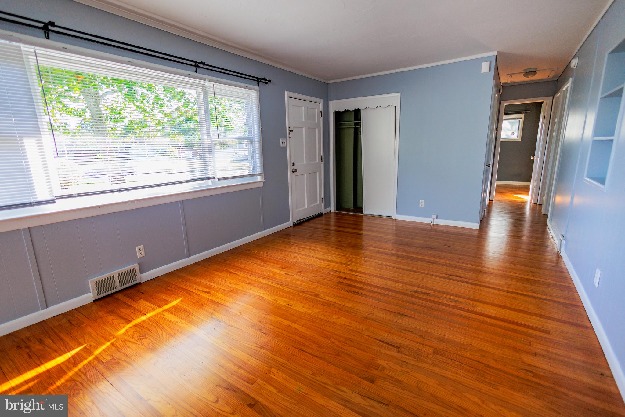 200 Baldwin Road Glassboro, NJ 08028 - Photo 7 of 29 a view of an empty room with wooden floor and a window