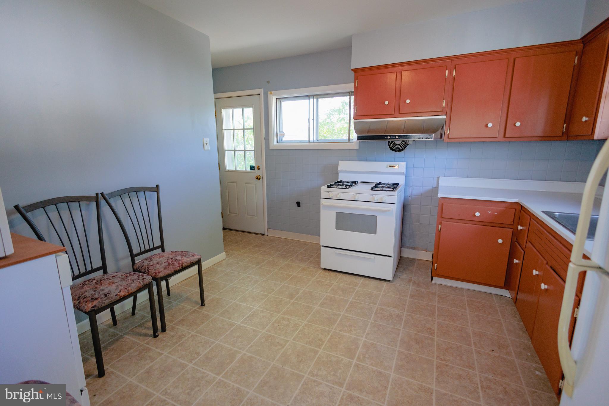 200 Baldwin Road Glassboro, NJ 08028 - Photo 8 of 29 a kitchen with a sink a stove and cabinets