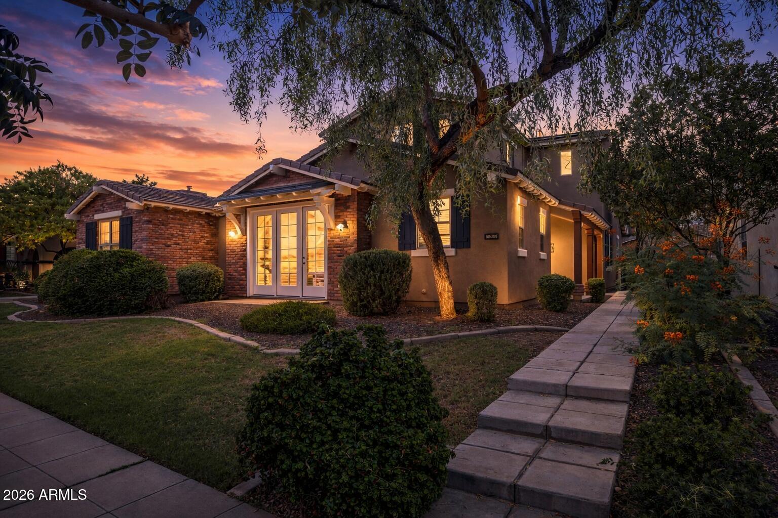 15366 West Bloomfield Road Surprise, AZ 85379 - Photo 19 of 48 a front view of a house with garden