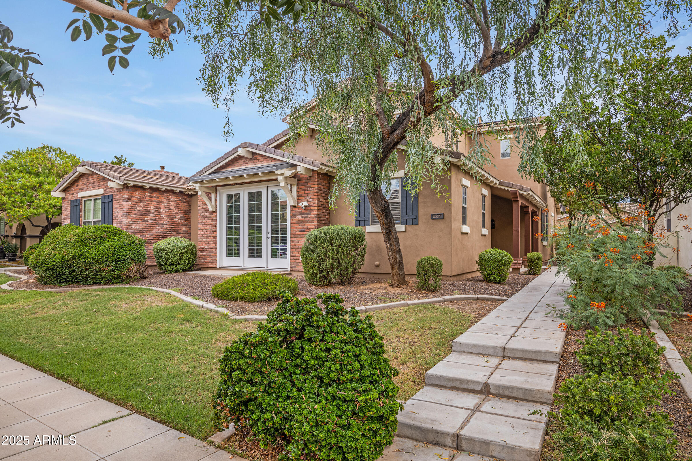 15366 West Bloomfield Road Surprise, AZ 85379 - Photo 20 of 48 a front view of a house with a yard