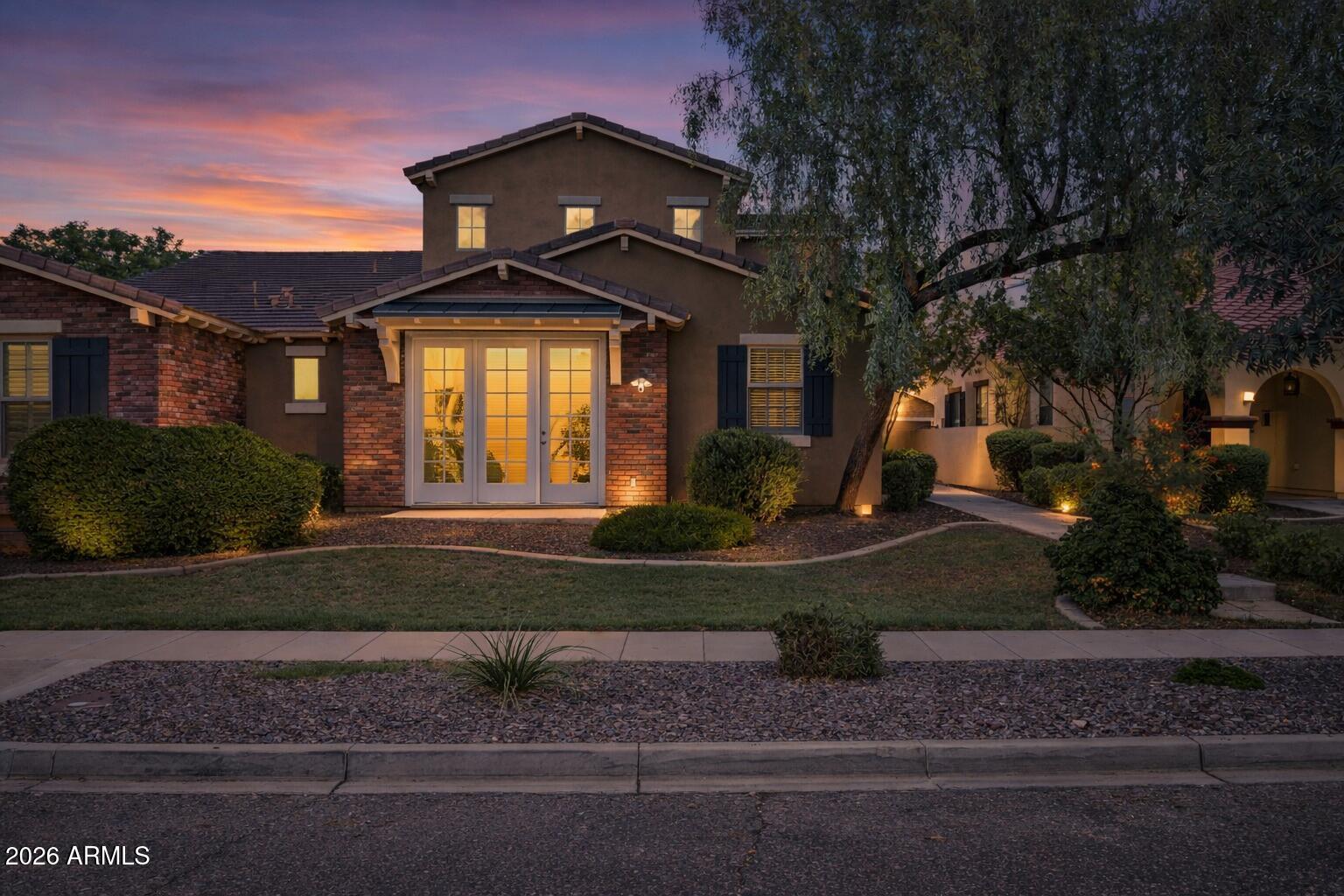 15366 West Bloomfield Road Surprise, AZ 85379 - Photo 2 of 48 a front view of a house with a yard
