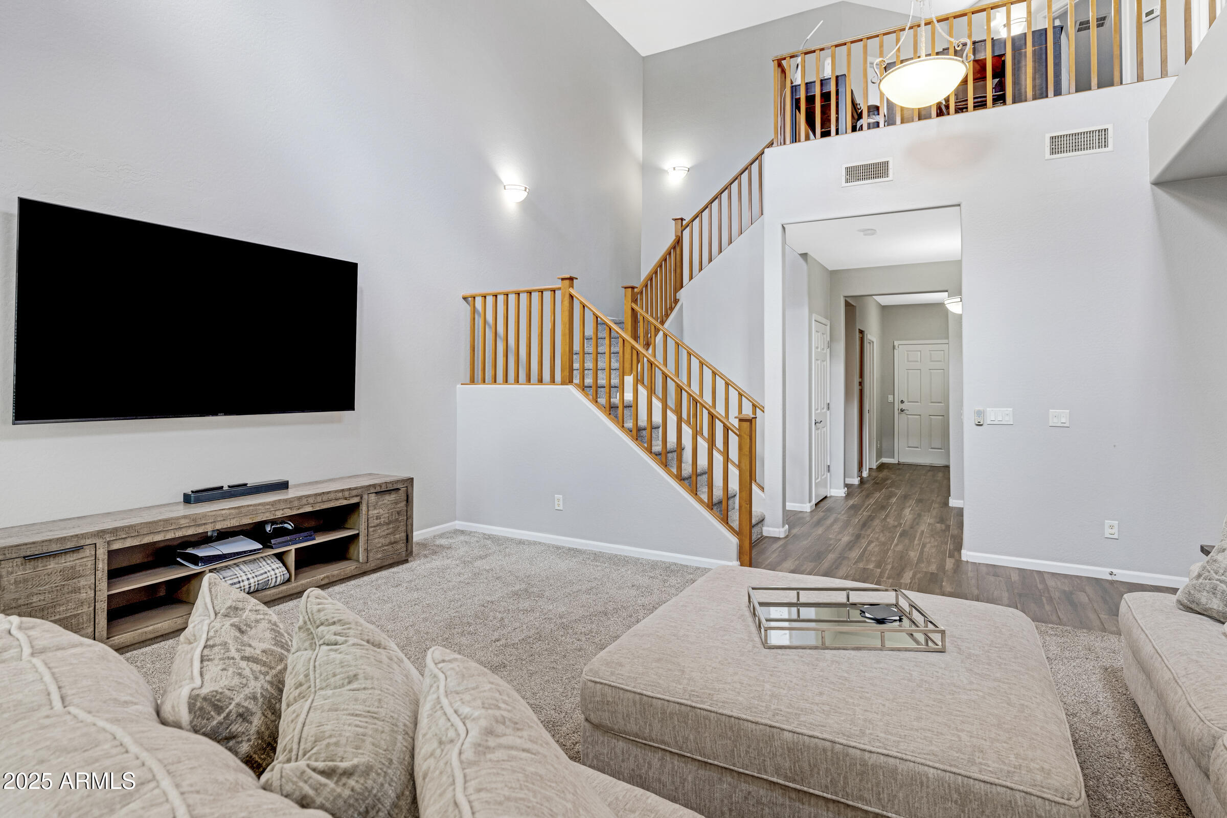 15366 West Bloomfield Road Surprise, AZ 85379 - Photo 23 of 48 a view of a livingroom with furniture and a flat screen tv