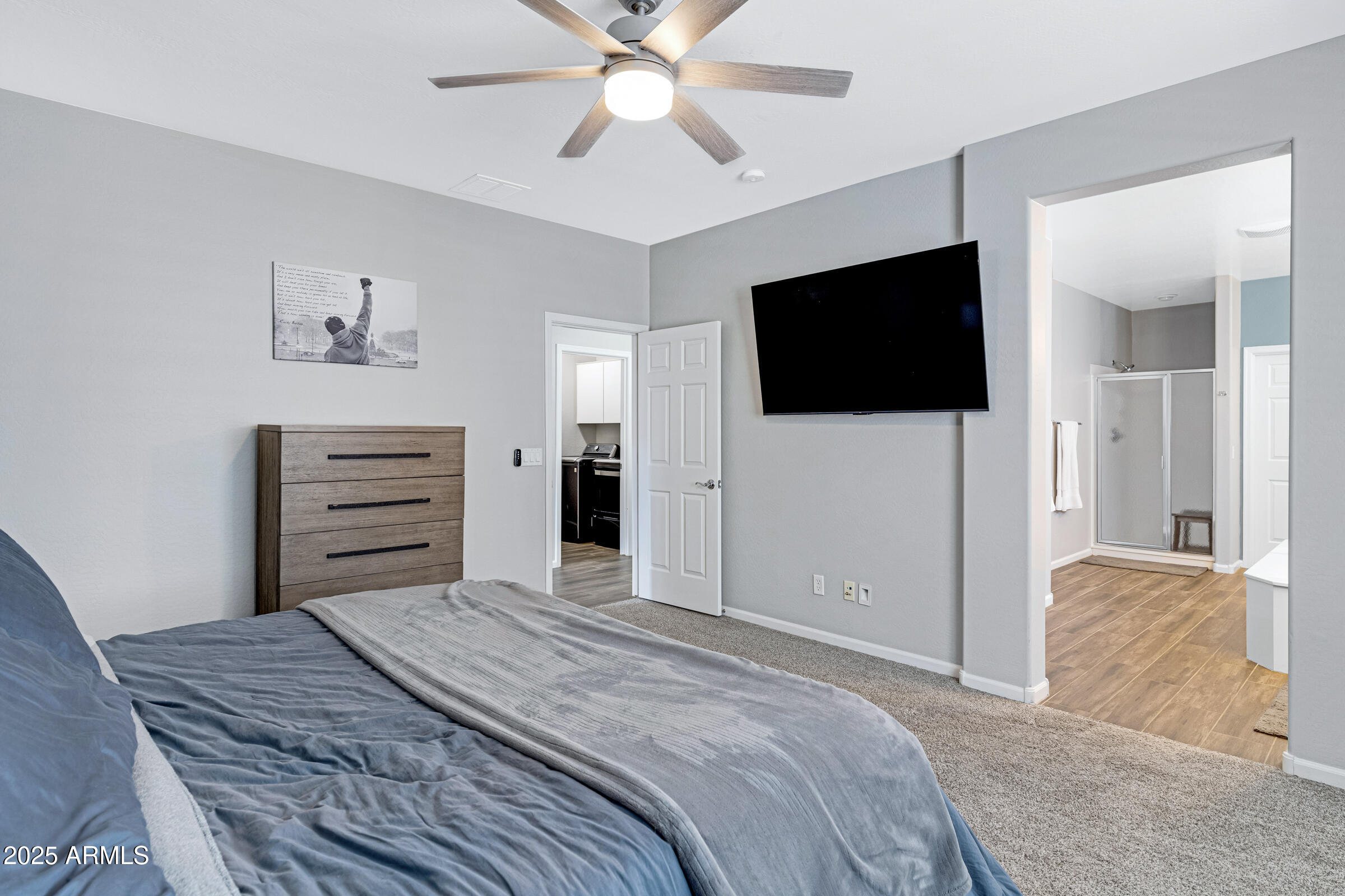 15366 West Bloomfield Road Surprise, AZ 85379 - Photo 28 of 48 a bedroom with a bed and a flat screen tv