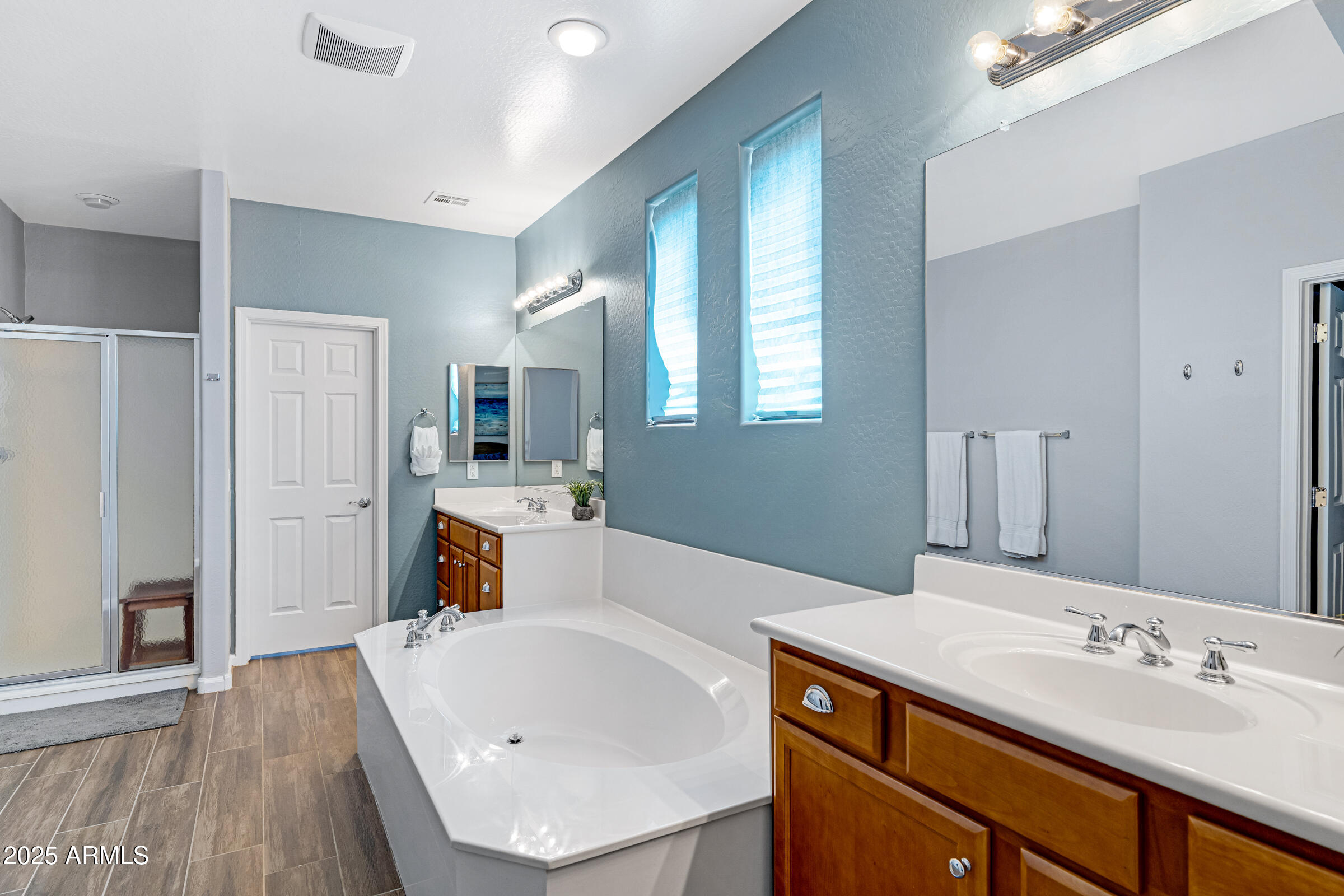 15366 West Bloomfield Road Surprise, AZ 85379 - Photo 29 of 48 a spacious bathroom with a sink double vanity granite and a large mirror