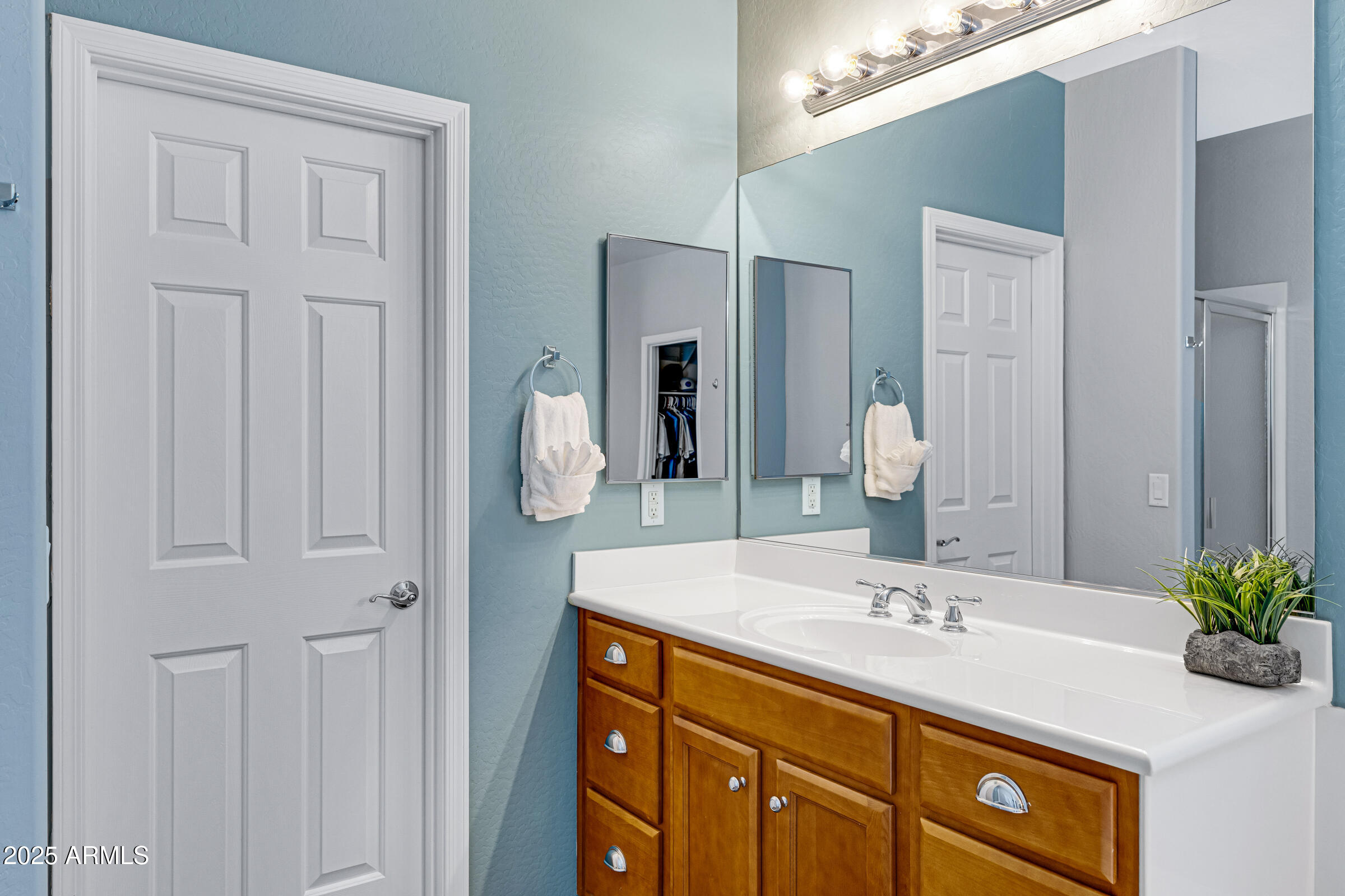 15366 West Bloomfield Road Surprise, AZ 85379 - Photo 30 of 48 a bathroom with a granite countertop sink and a mirror