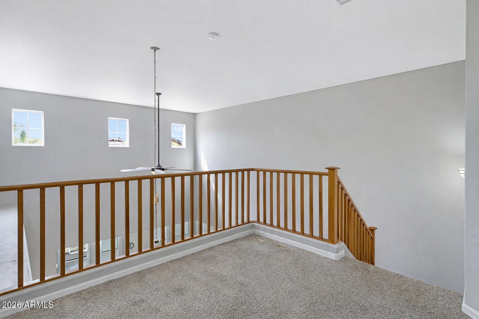 15366 West Bloomfield Road Surprise, AZ 85379 - Photo 32 of 48 a view of a hallway with a chandelier