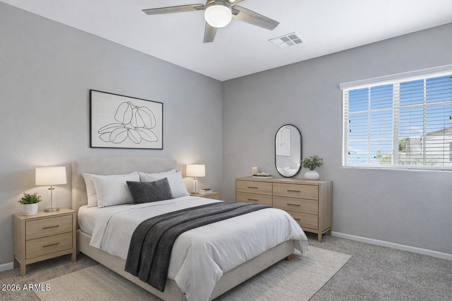 15366 West Bloomfield Road Surprise, AZ 85379 - Photo 33 of 48 a bedroom with a large bed and a chandelier