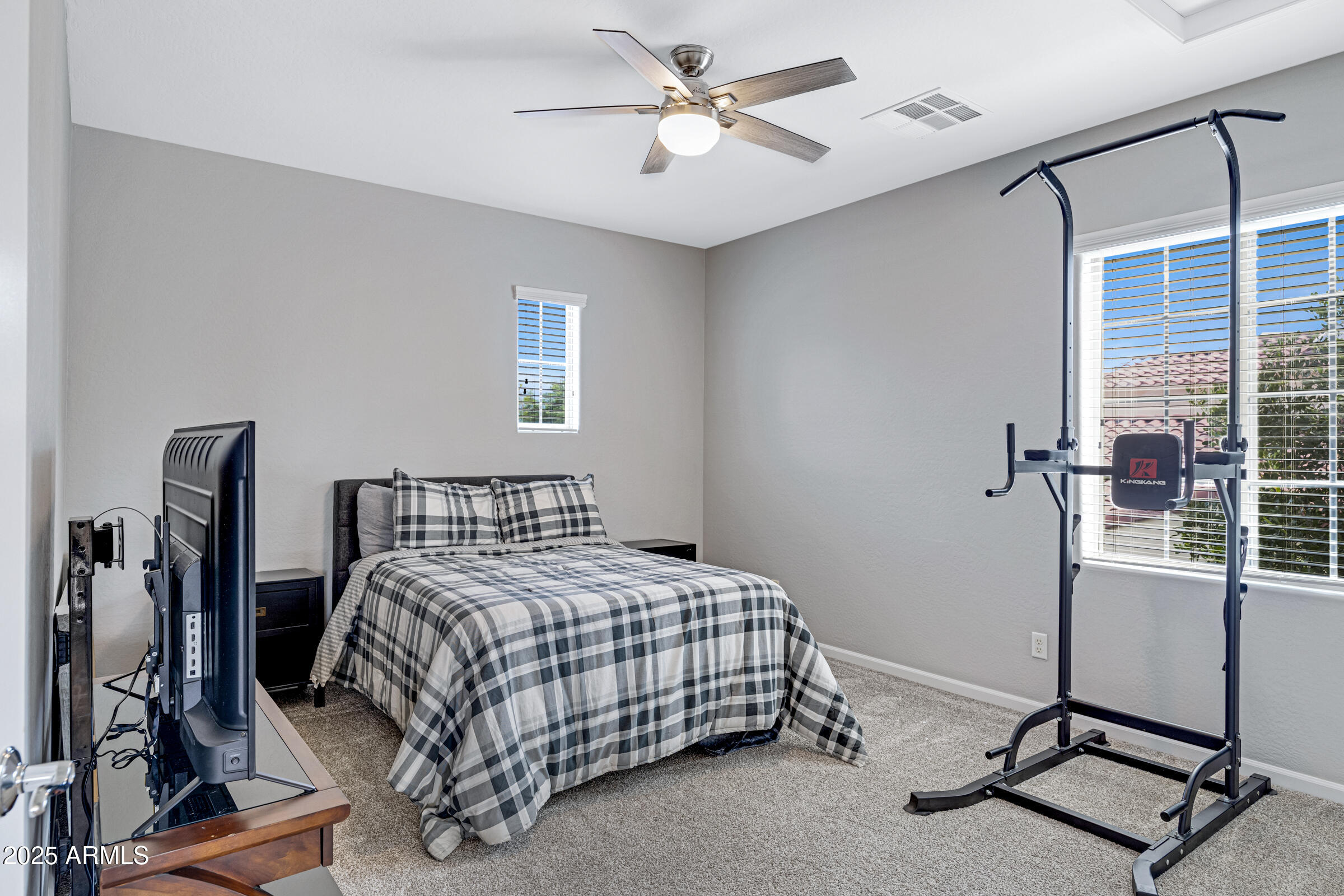 15366 West Bloomfield Road Surprise, AZ 85379 - Photo 34 of 48 a bedroom with a bed and a window