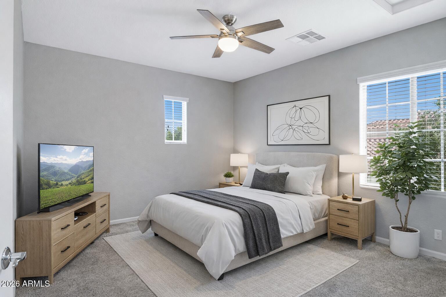 15366 West Bloomfield Road Surprise, AZ 85379 - Photo 35 of 48 a bedroom with a bed and a flat screen tv