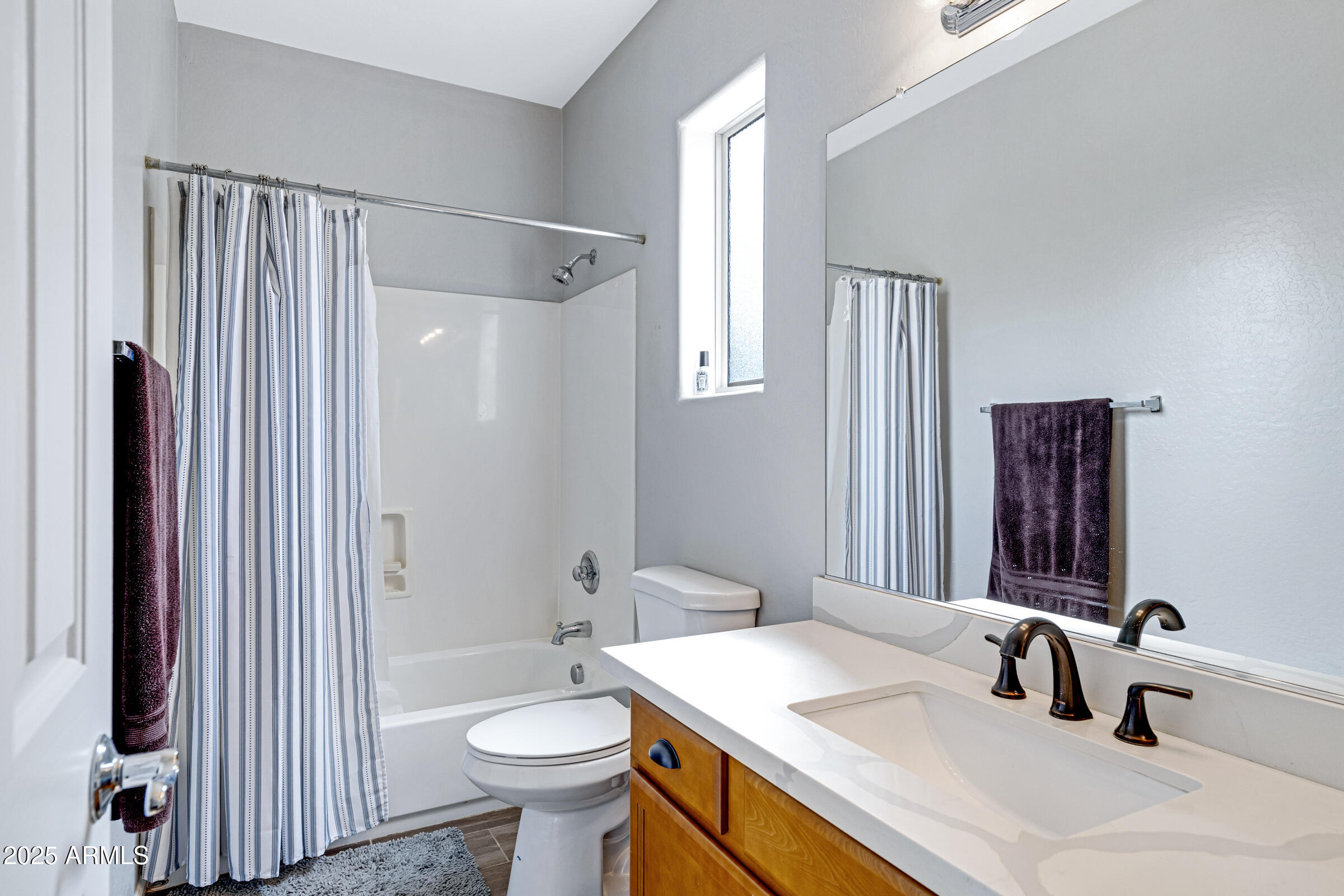 15366 West Bloomfield Road Surprise, AZ 85379 - Photo 37 of 48 a bathroom with a sink toilet and shower