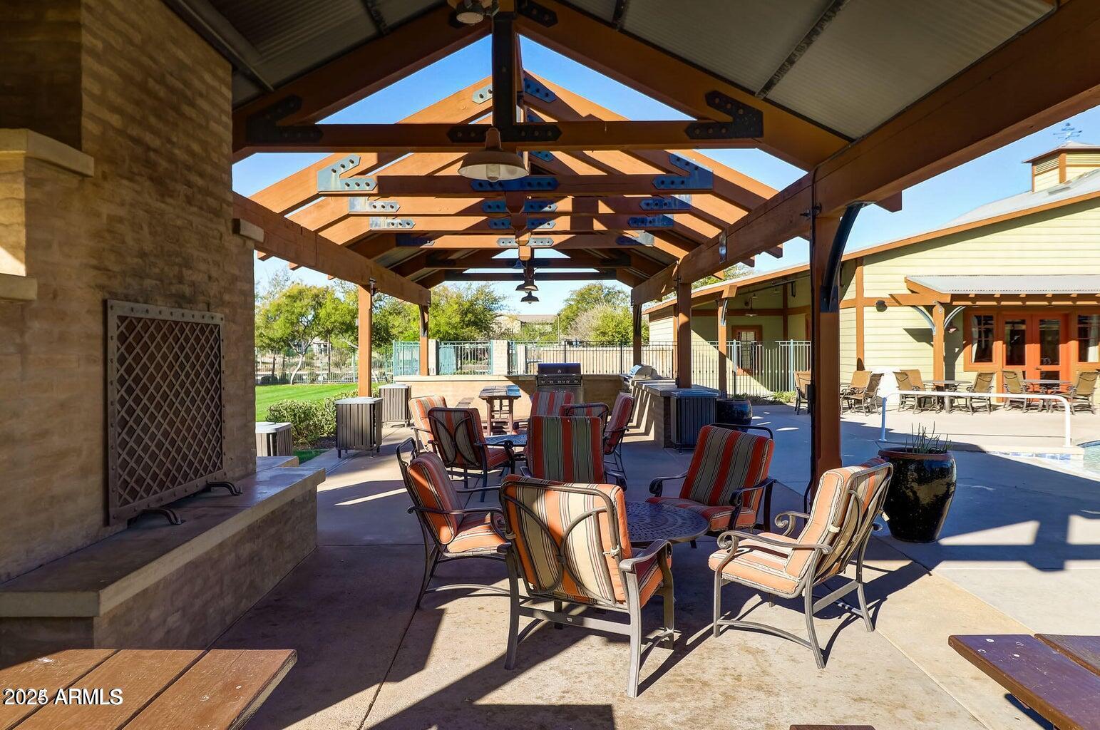 15366 West Bloomfield Road Surprise, AZ 85379 - Photo 43 of 48 a view of a patio with table and chairs under an umbrella