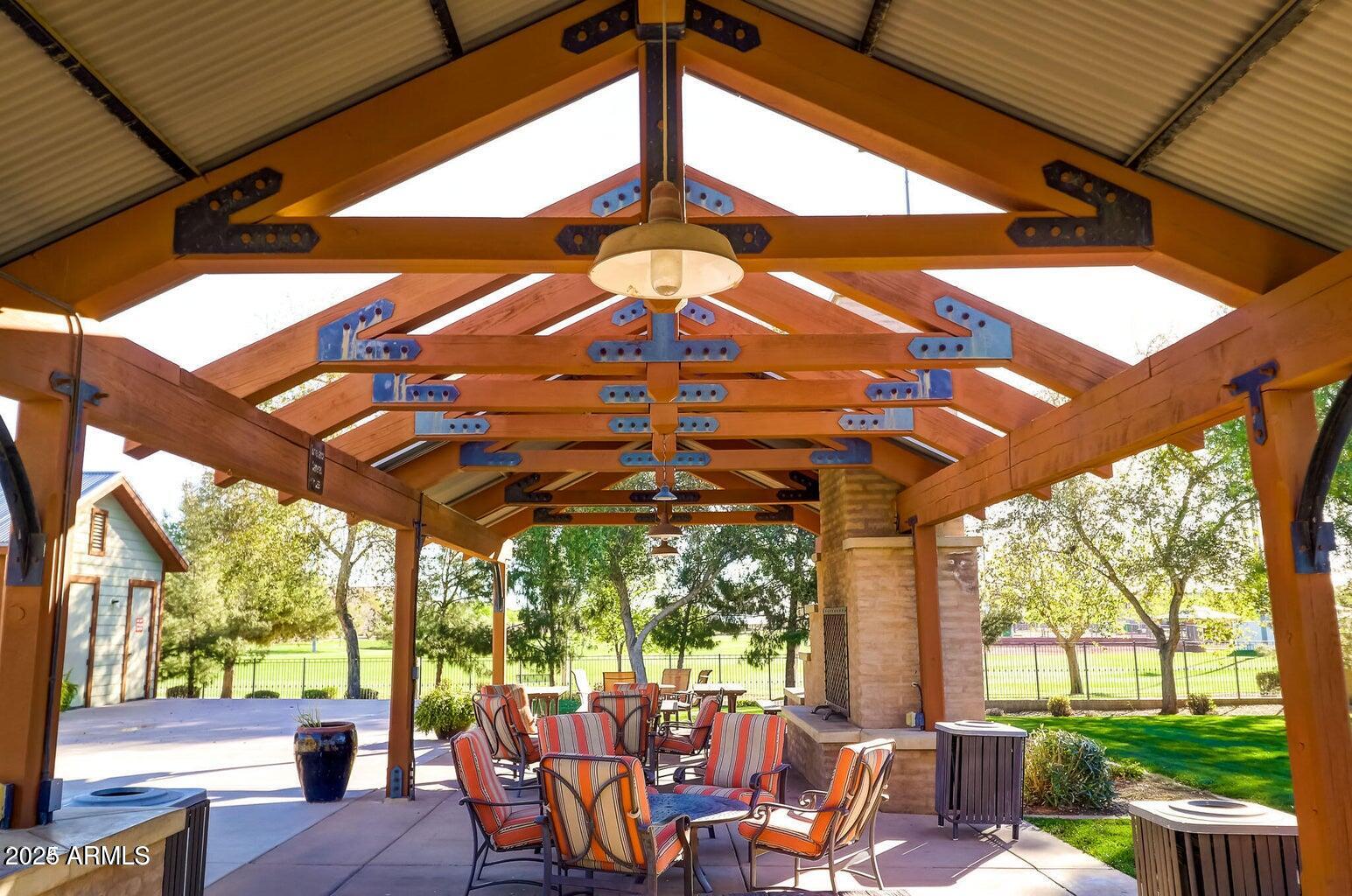 15366 West Bloomfield Road Surprise, AZ 85379 - Photo 45 of 48 a view of a patio with table and chairs under an umbrella