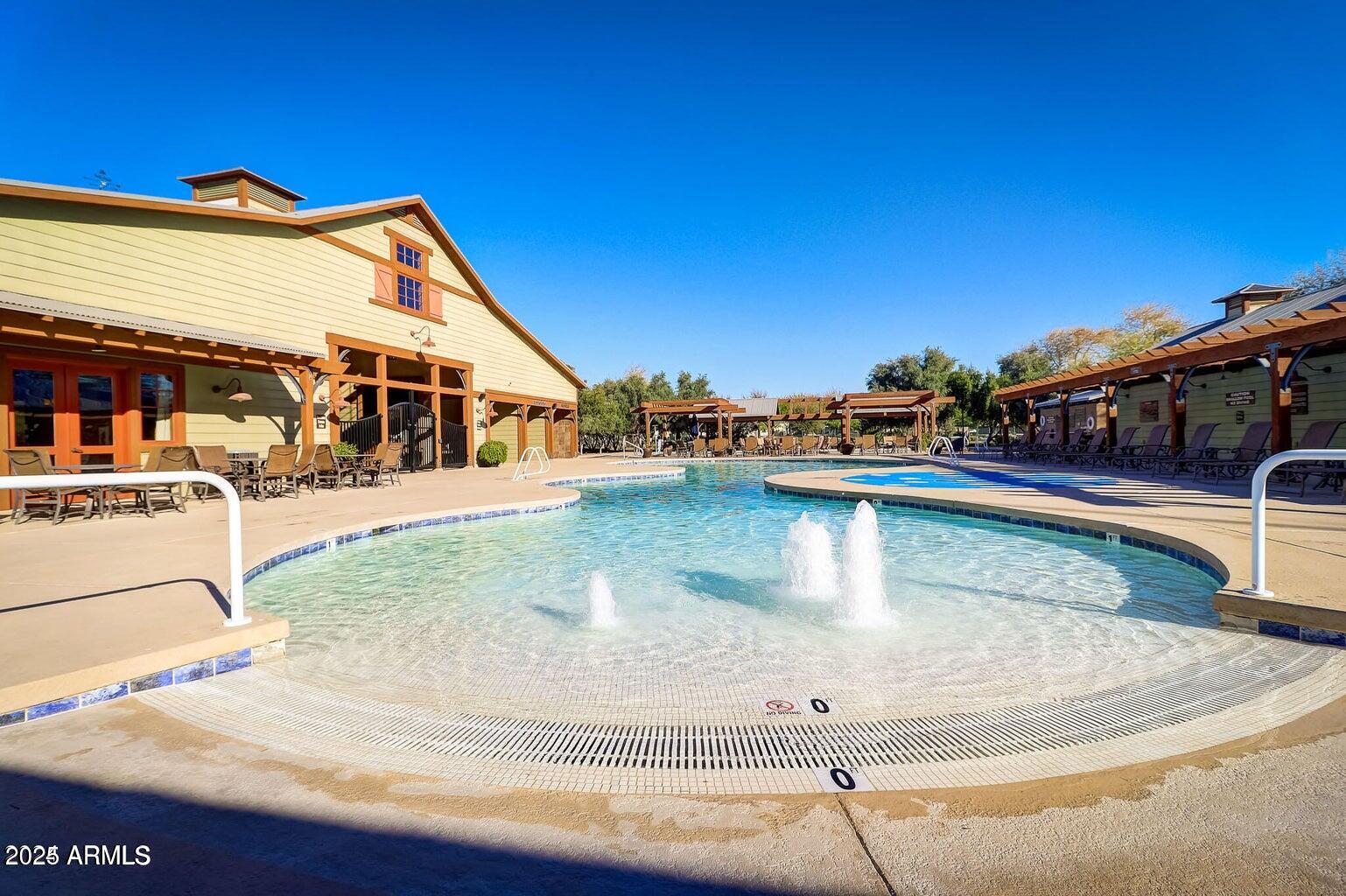 15366 West Bloomfield Road Surprise, AZ 85379 - Photo 46 of 48 a view of a swimming pool with a chair