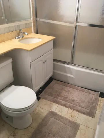 a bathroom with a sink and toilet