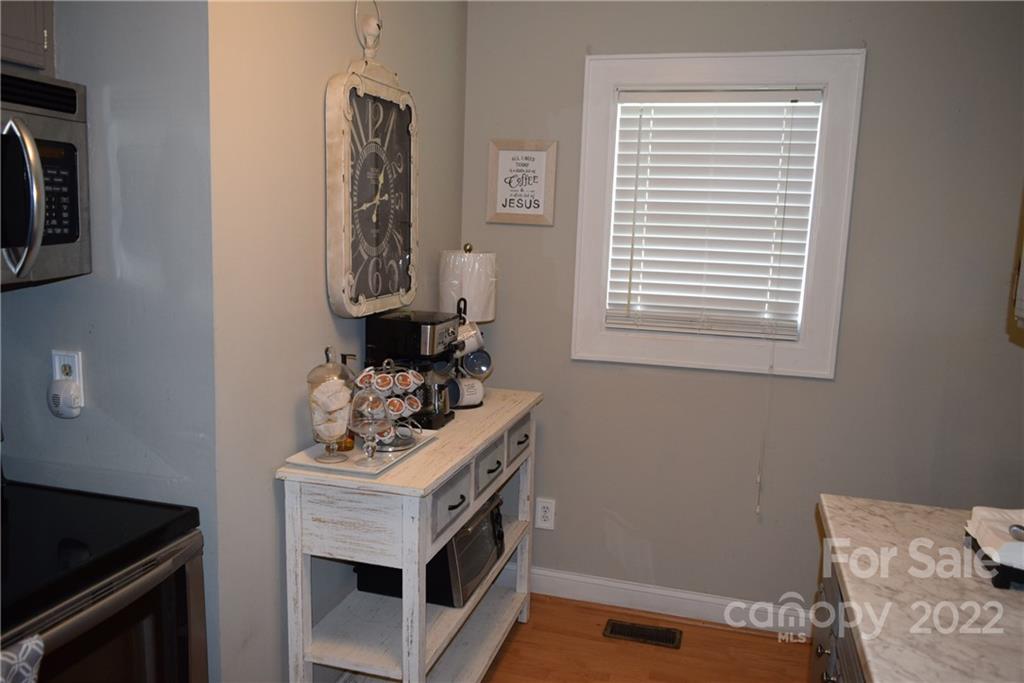 3136 Pea Ridge Road Mill Spring, NC 28756 - Photo 12 of 24 a bathroom with a sink and a mirror