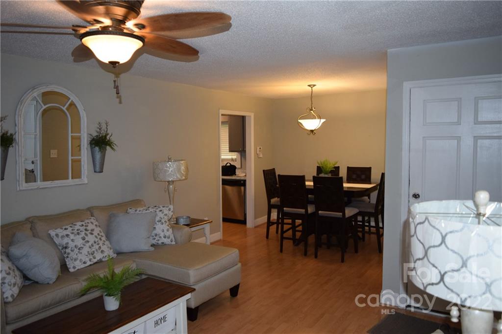 3136 Pea Ridge Road Mill Spring, NC 28756 - Photo 7 of 24 a living room with furniture and chandelier