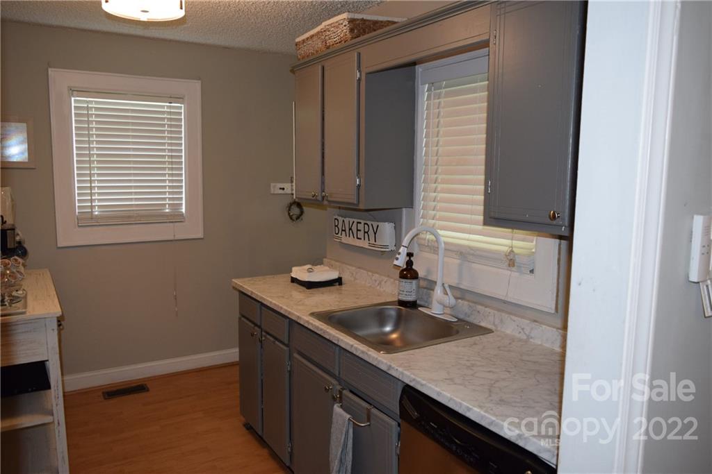 3136 Pea Ridge Road Mill Spring, NC 28756 - Photo 9 of 24 a kitchen with sink and window