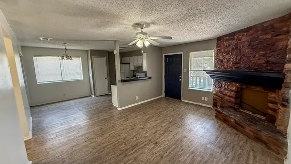 a view of livingroom with hardwood floor and a ceiling fan