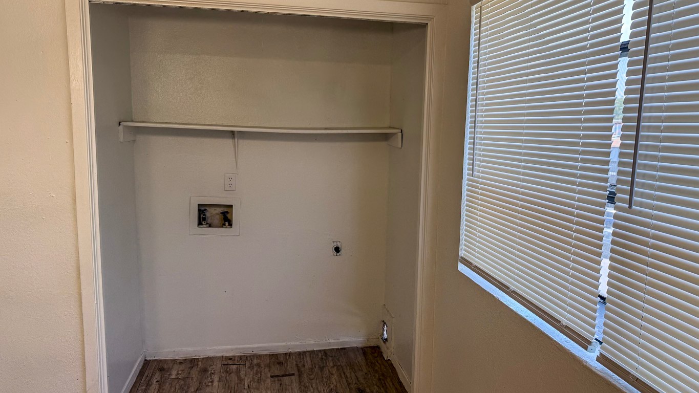 501 Hardin Court, Unit D Austin, TX 78753 - Photo 5 of 13 a view of a room with rack on the wall