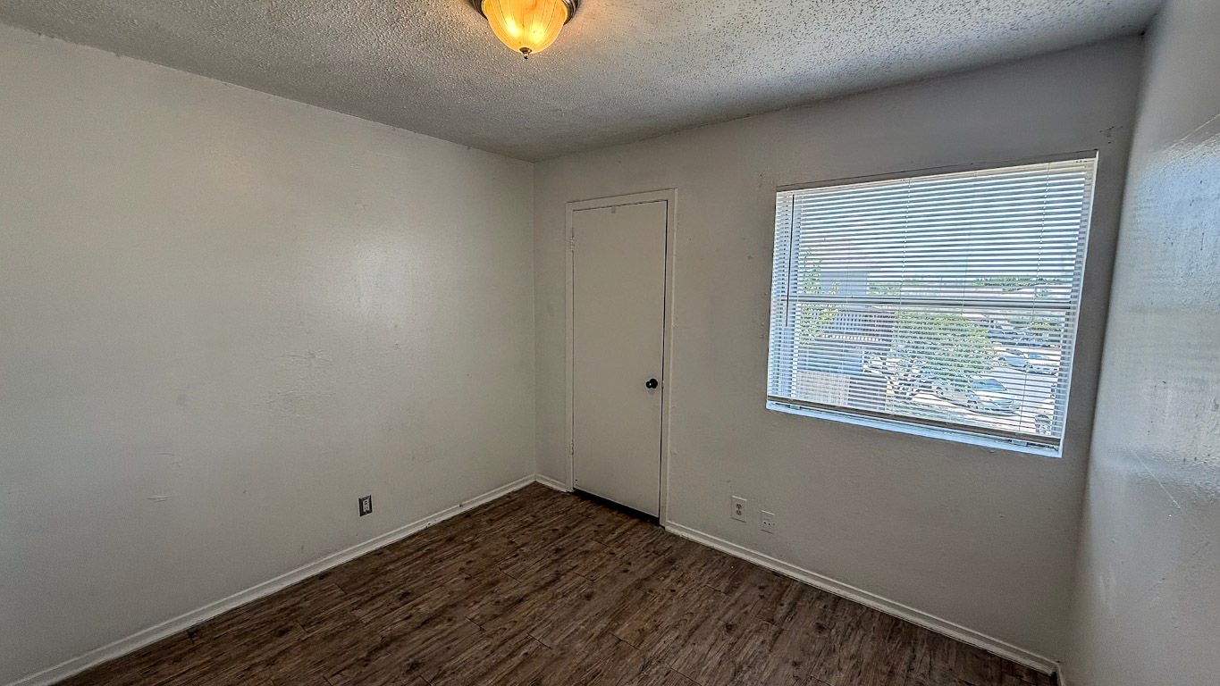 501 Hardin Court, Unit D Austin, TX 78753 - Photo 10 of 13 an empty room with a window