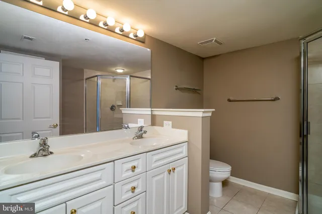 a bathroom with a glass shower door