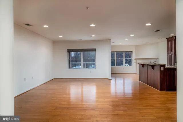 a view of kitchen with furniture and wooden floor