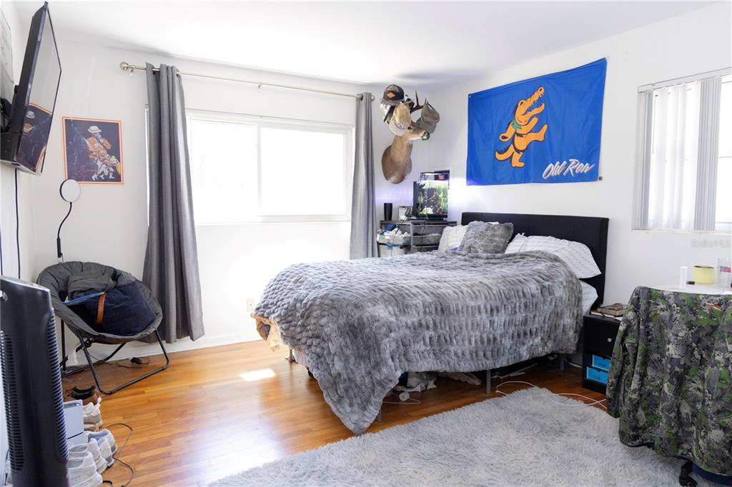 2910 Southwest 1st Avenue Gainesville, FL 32607 - Photo 7 of 16 a bedroom with a bed and a window