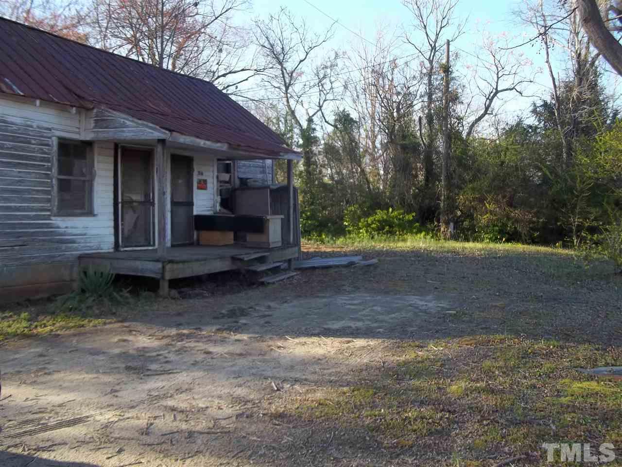 1314 Hardwood Road Roxboro, NC 27573 - Photo 1 of 6 a view of a house with a yard