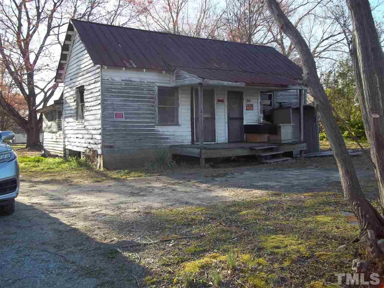 1314 Hardwood Road Roxboro, NC 27573 - Photo 5 of 6 a view of a house with backyard and a tree