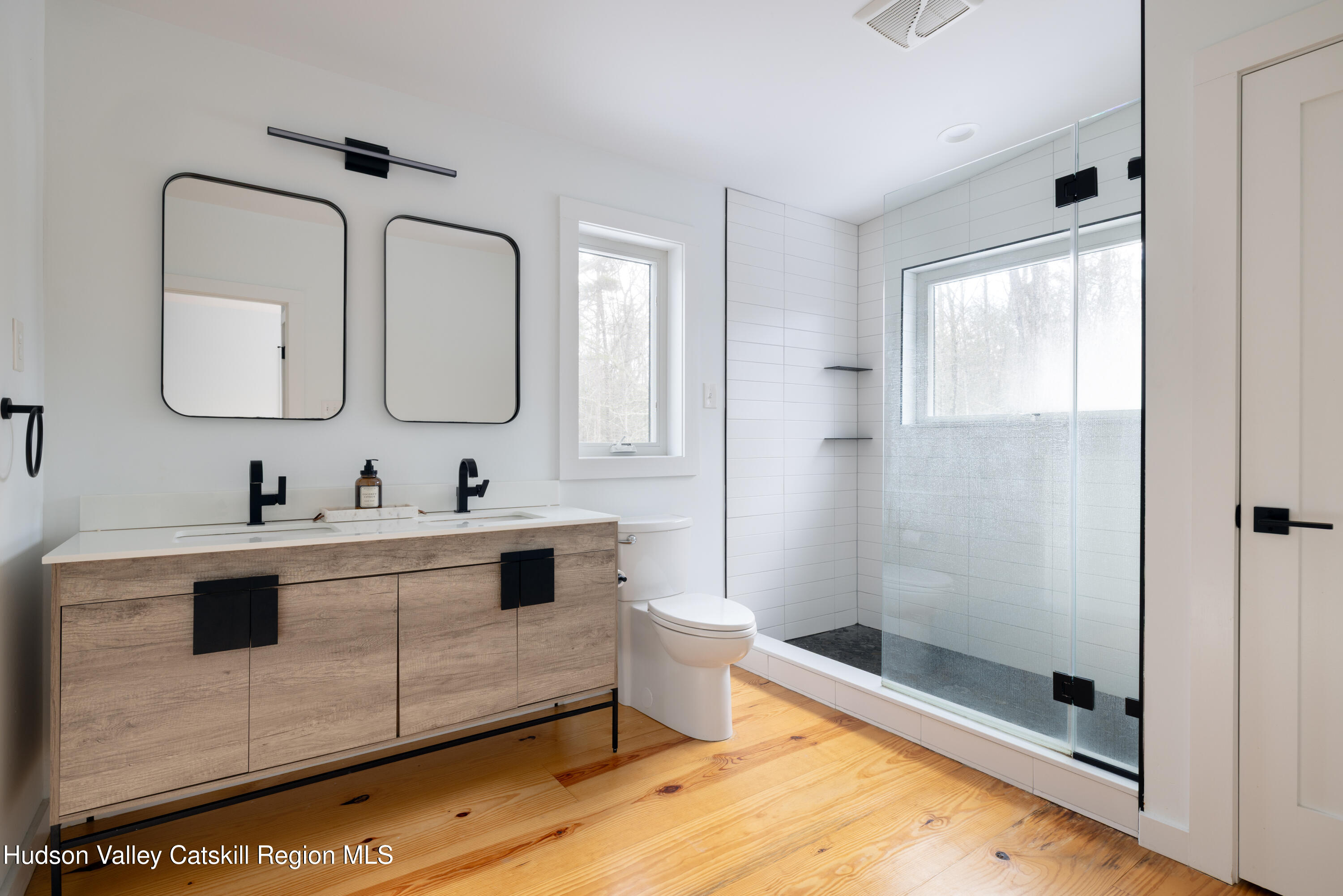 158 Rivka Road Saugerties, NY 12477 - Photo 18 of 35 a bathroom with a double vanity sink mirror and shower