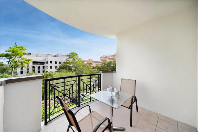 a view of balcony with furniture