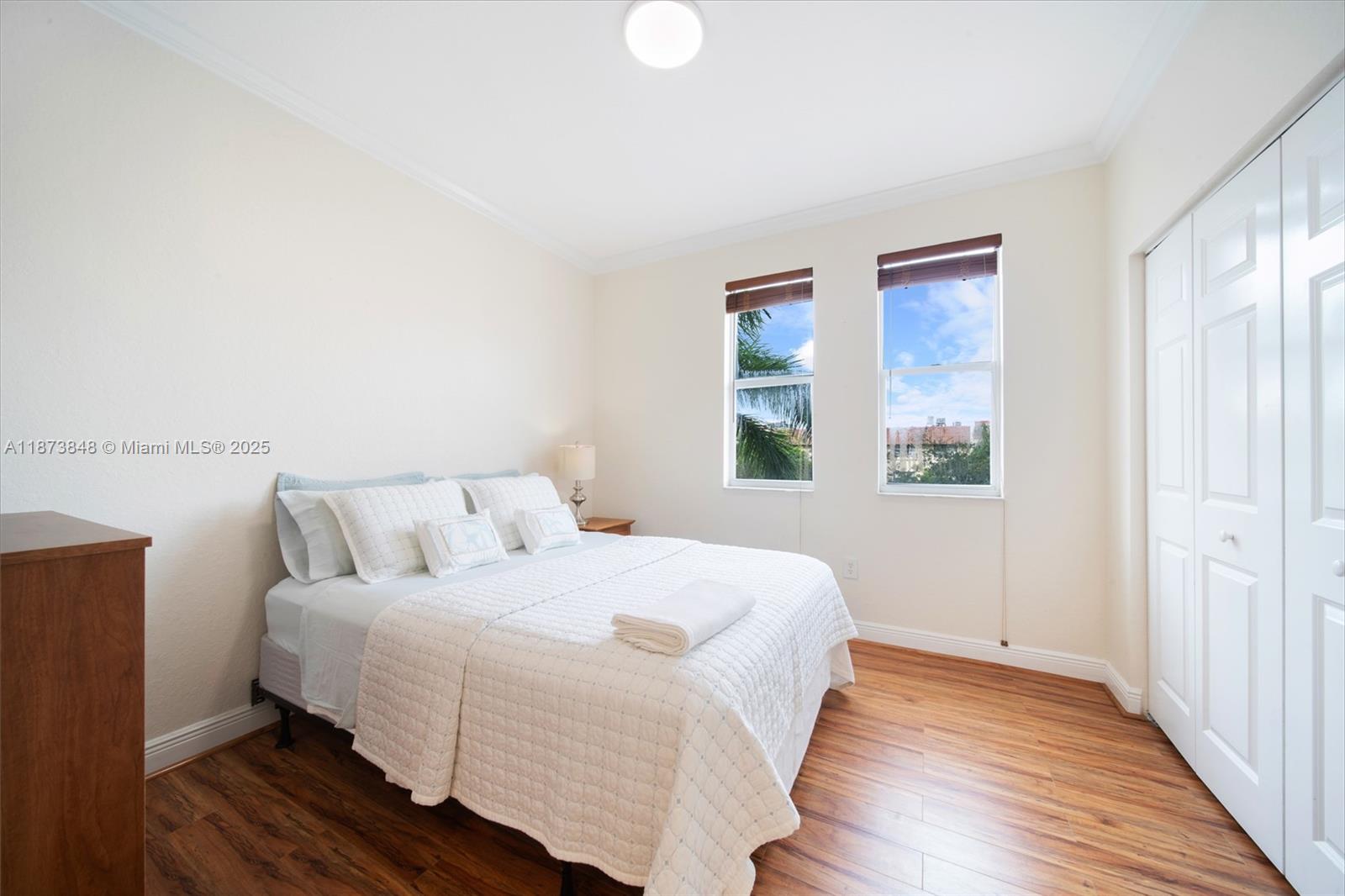 9021 Southwest 94th Street, Unit 310 Miami, FL 33176 - Photo 23 of 41 a bedroom with a bed and a window