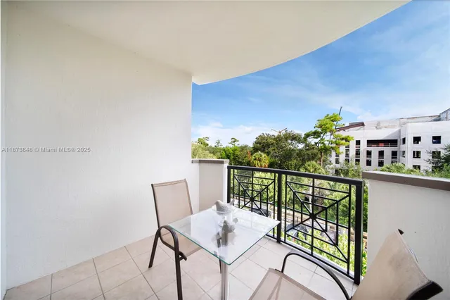 a view of a balcony with chairs