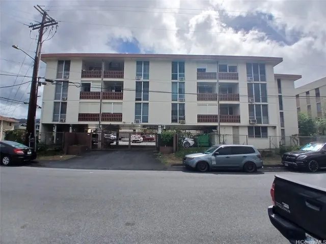 a cars parked in front of a building