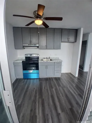 a kitchen with a sink stainless steel appliances and cabinets