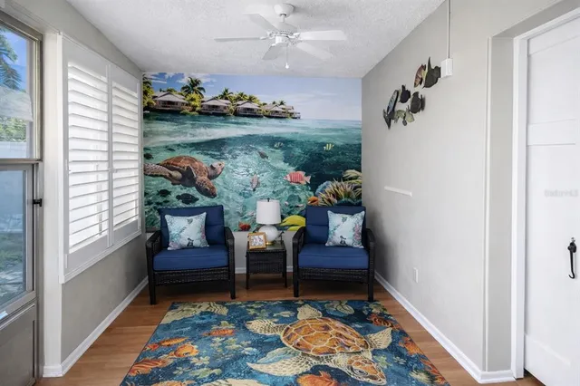 a living room with furniture and a rug