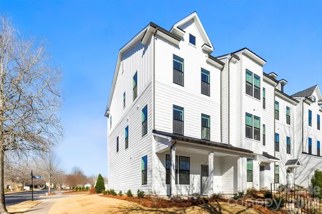 a view of a building with a yard