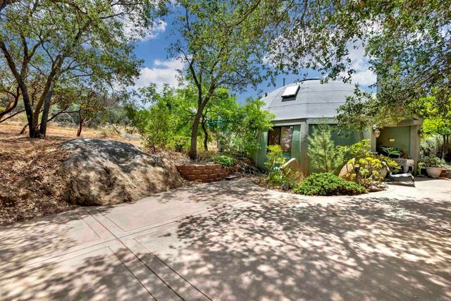 a view of a house with a snow in the yard