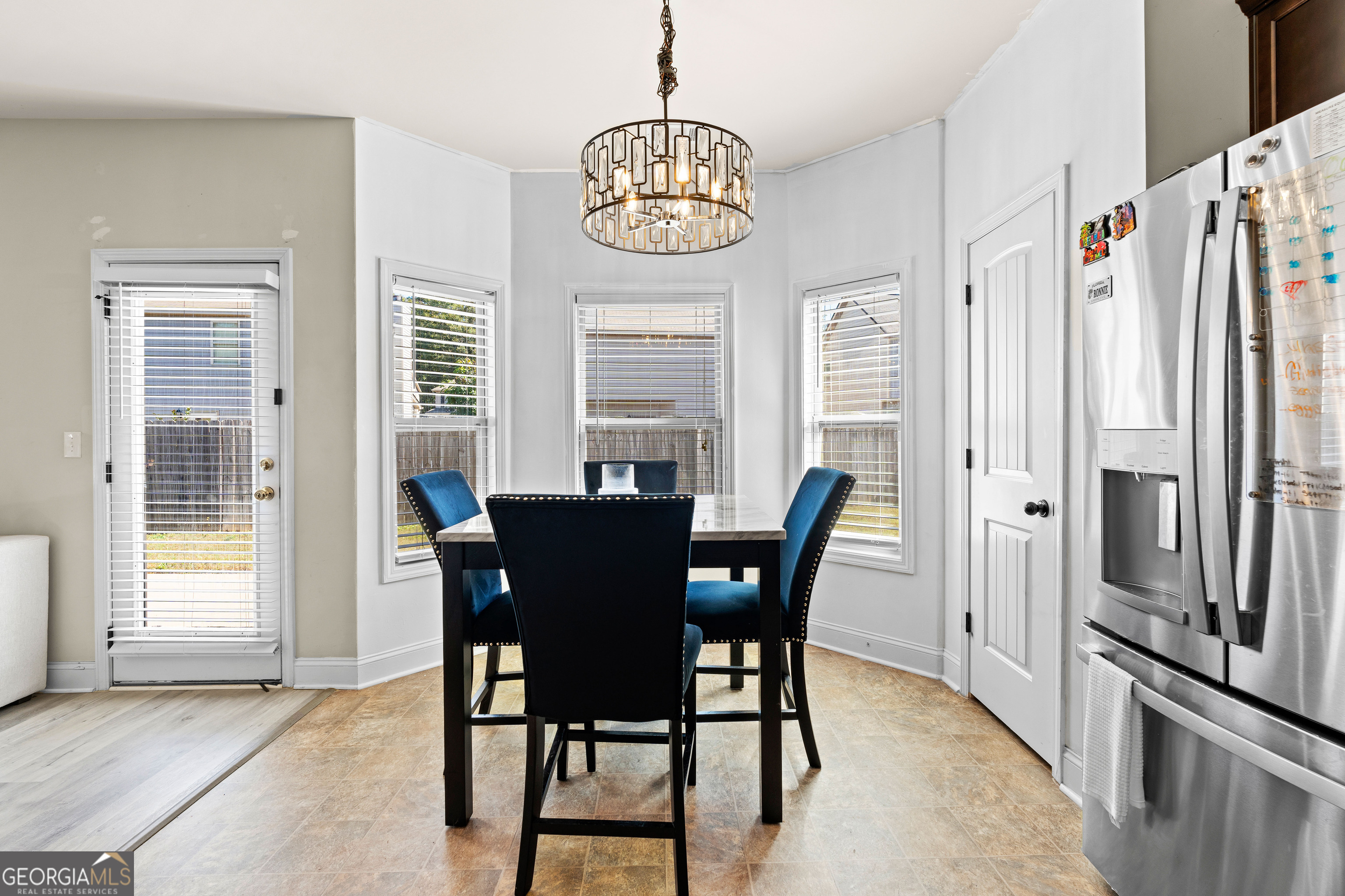112 Truman Court Jackson, GA 30233 - Photo 11 of 42 a view of a dining room with furniture window and wooden floor