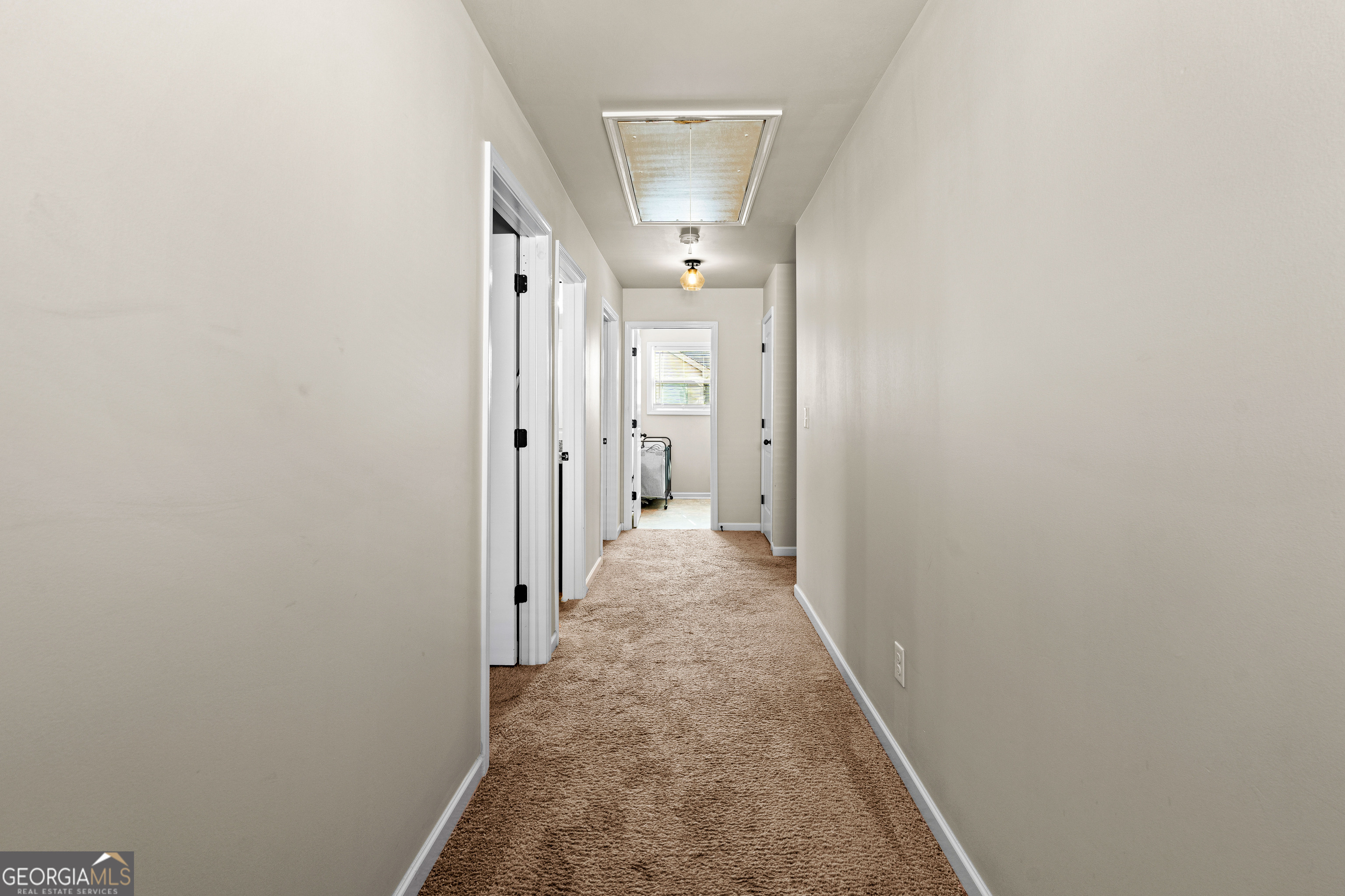 112 Truman Court Jackson, GA 30233 - Photo 20 of 42 a view of a hallway with a white walls