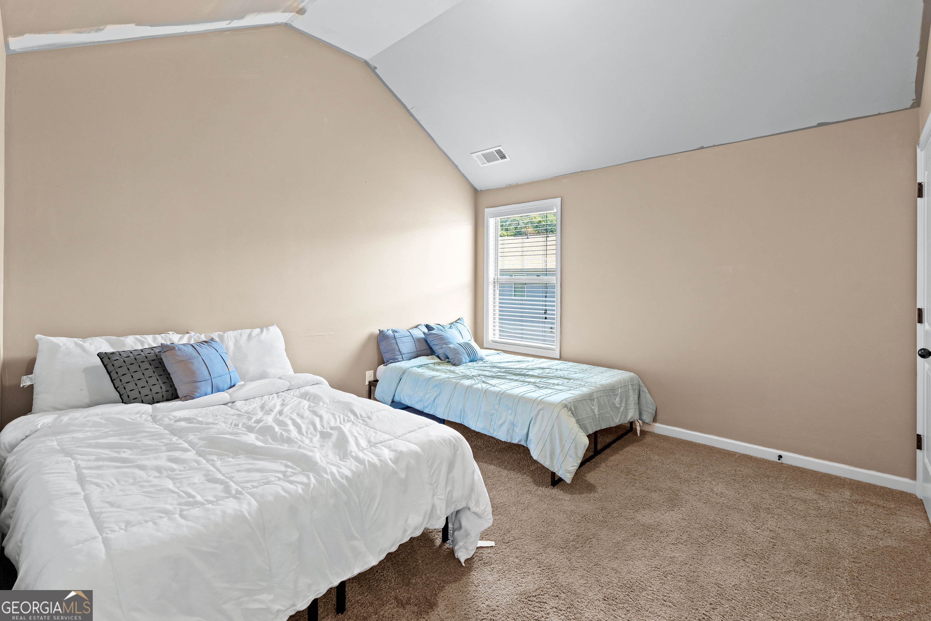 112 Truman Court Jackson, GA 30233 - Photo 21 of 42 a bedroom with two beds and a window