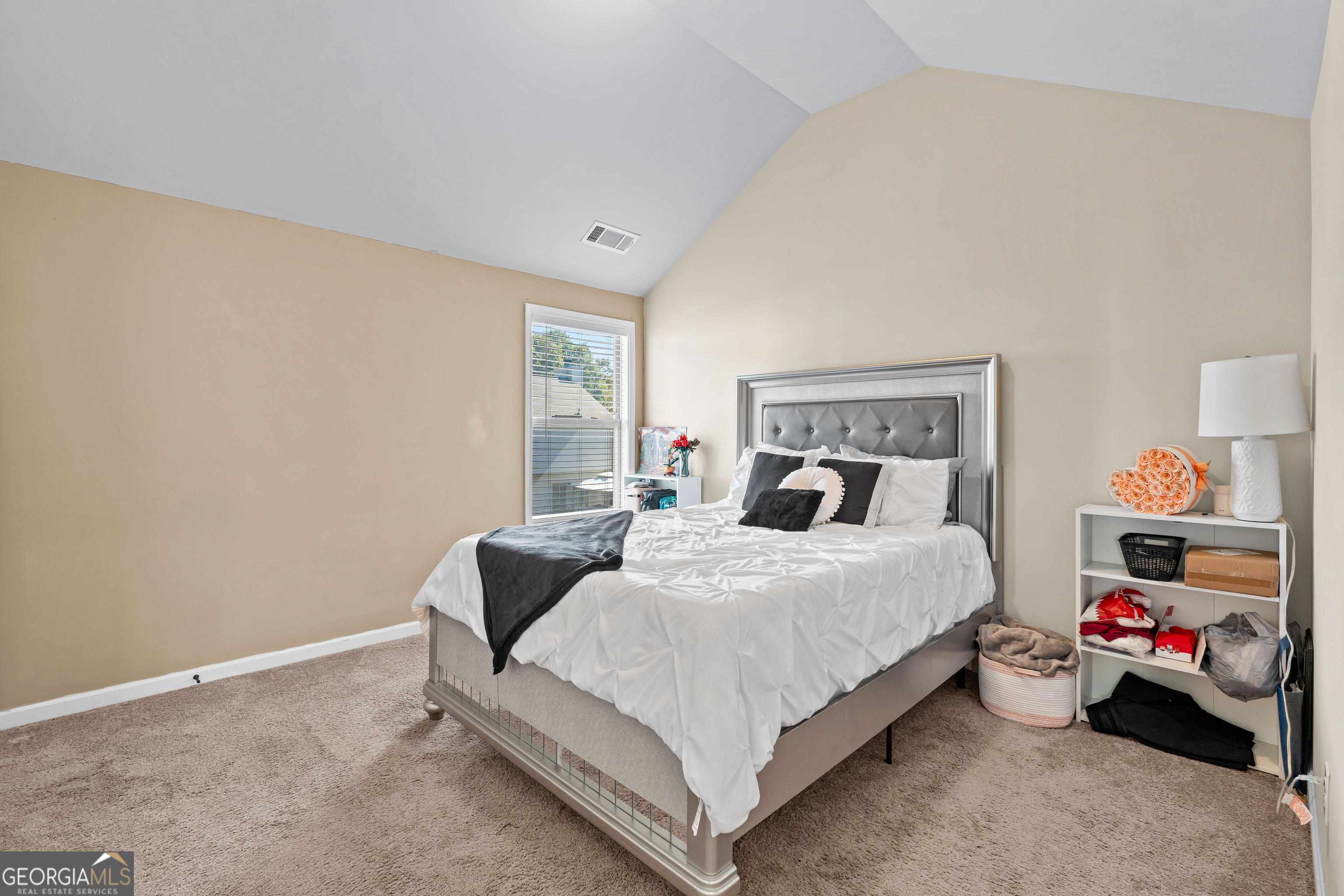112 Truman Court Jackson, GA 30233 - Photo 25 of 42 a bedroom with a bed and a couch
