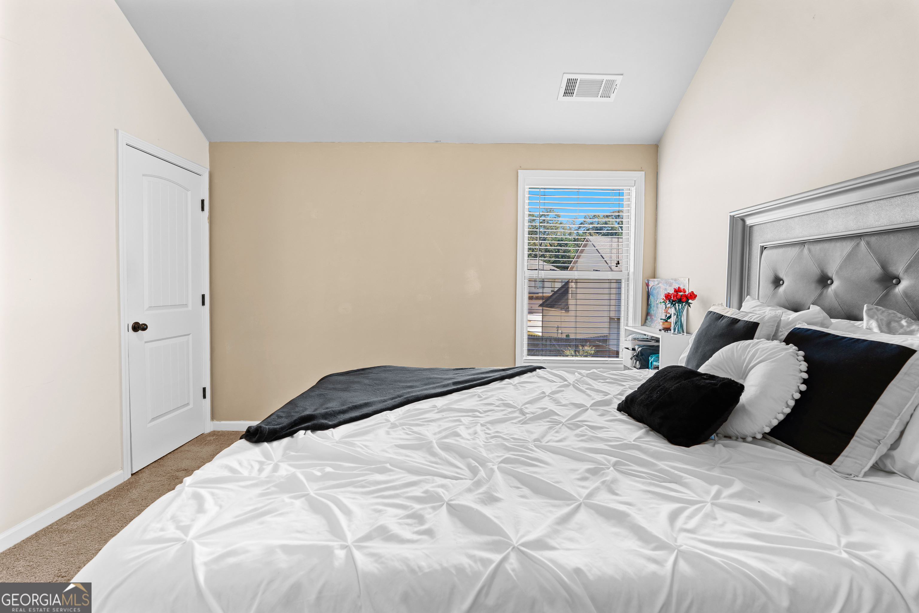 112 Truman Court Jackson, GA 30233 - Photo 26 of 42 a bedroom with a bed window and walk in closet