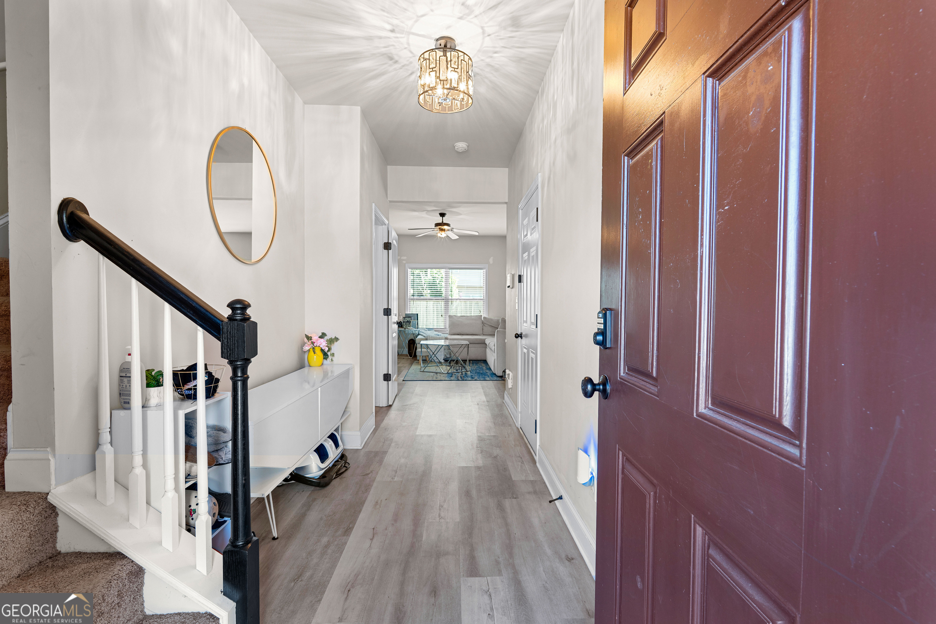 112 Truman Court Jackson, GA 30233 - Photo 6 of 42 a view of a hallway view with wooden floor and staircase