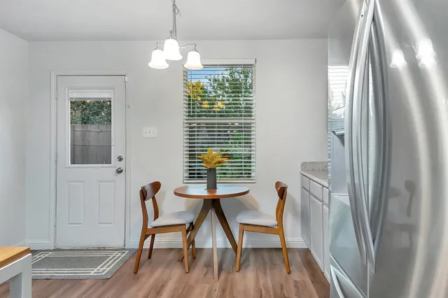 a workspace room with furniture and a window