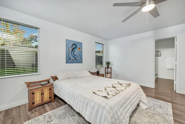 a bedroom with a bed and a table