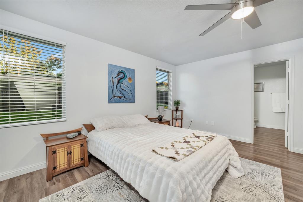 2633 Rockport Lane Little Elm, TX 75068 - Photo 16 of 39 a bedroom with a bed and a table