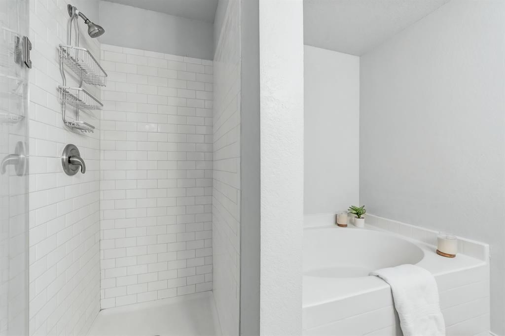 2633 Rockport Lane Little Elm, TX 75068 - Photo 19 of 39 a bathroom with a bathtub