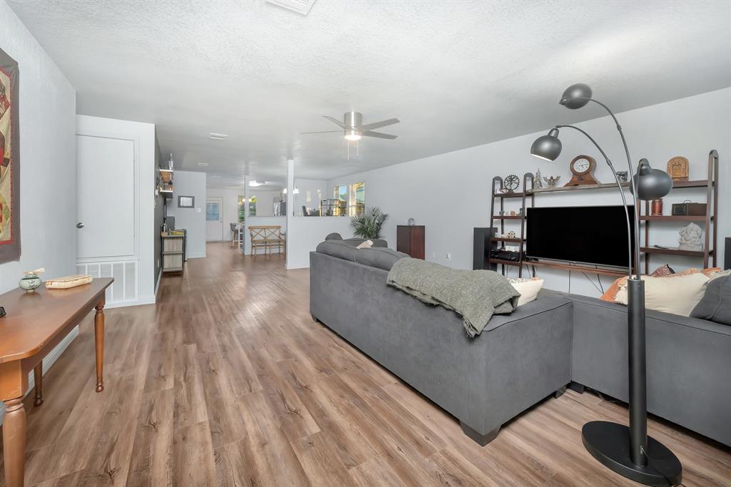 2633 Rockport Lane Little Elm, TX 75068 - Photo 2 of 39 a living room with furniture and a wooden floor