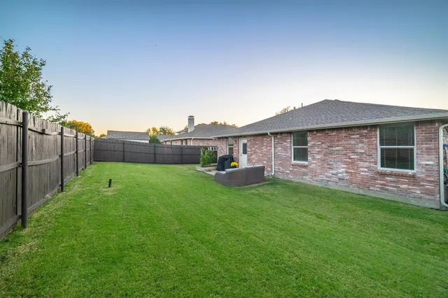 a view of a backyard with a garden